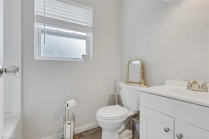 Bathroom with vanity and wood finished floors
