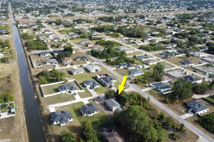 View of property location with nearby suburban area
