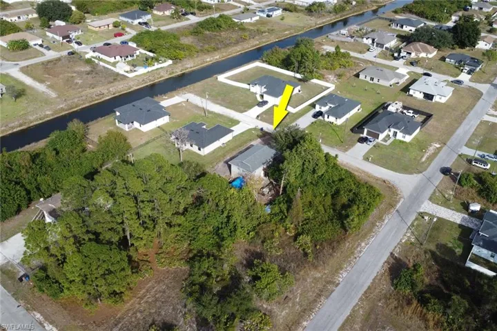 View of property location with nearby suburban area and a large body of water