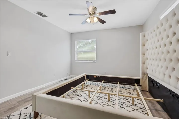 Bedroom featuring light wood-type flooring and a ceiling fan