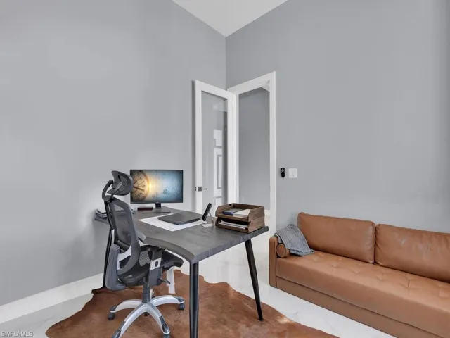Home office featuring concrete flooring