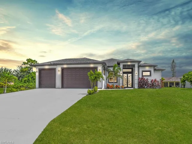 Prairie-style house featuring a garage and a yard