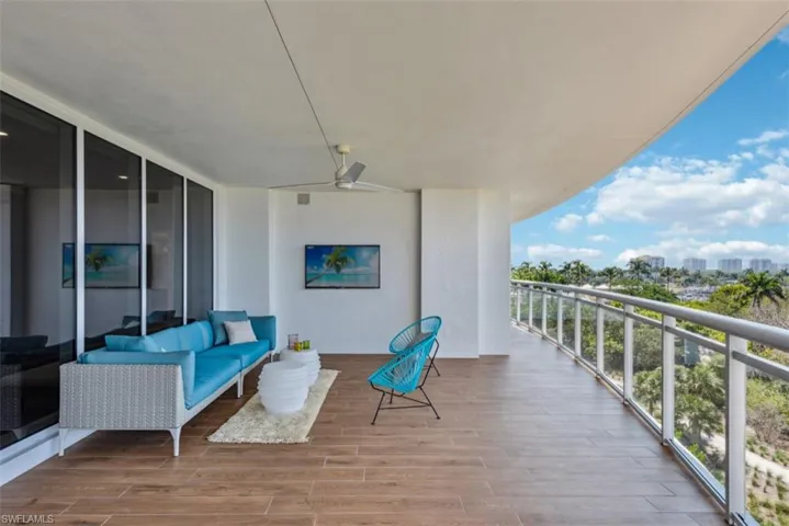 Balcony featuring ceiling fan