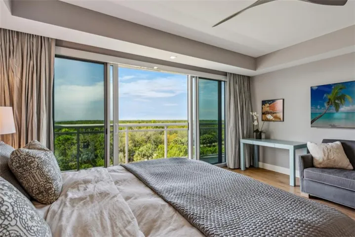 Bedroom featuring wood finished floors and access to outside