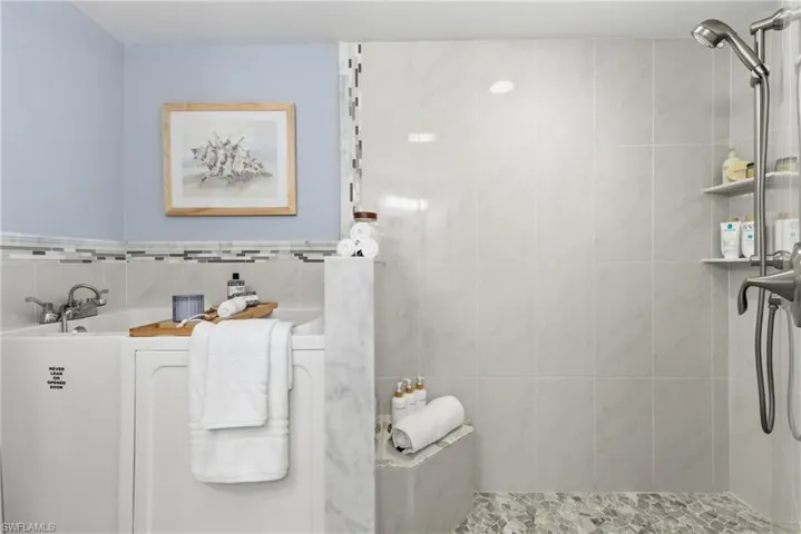 Master bath includes a therapeutic spa tub and walk in shower