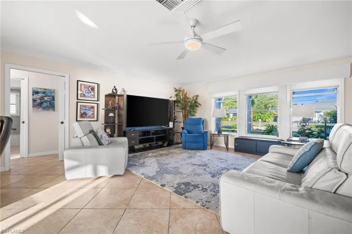 Notice the custom blinds and cornice over the east facing family room windows? Enjoy your morning coffee and the SW Florida sunrises!
