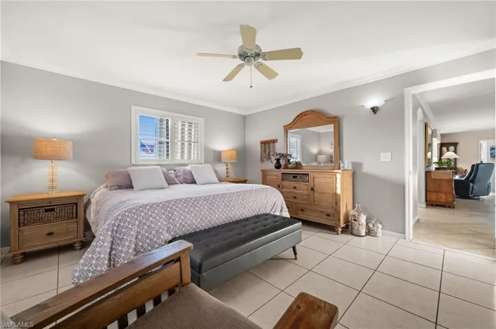 The primary bedroom is oversized and easily accommodates a desk or a large, comfy chair.