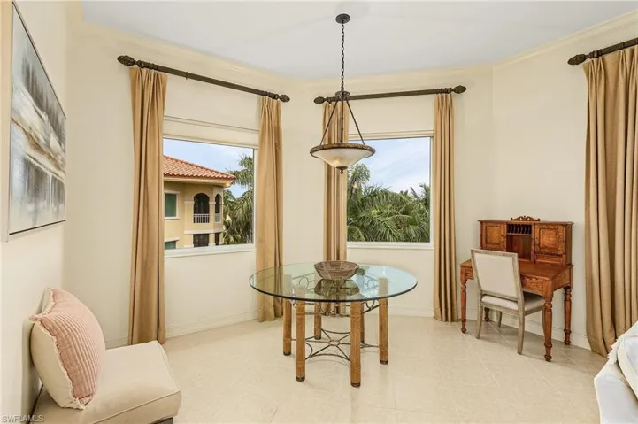 Open concept dining area with two perfectly placed windows that bring natural light into this area.