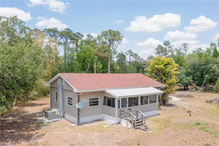 Rear view of house with a porch