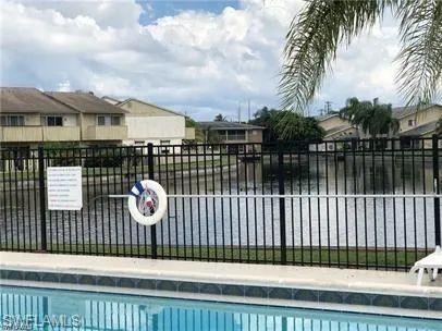 Community pool featuring a residential view