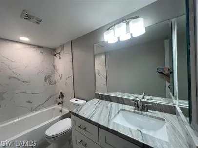 Full bathroom with vanity and bathtub / shower combination