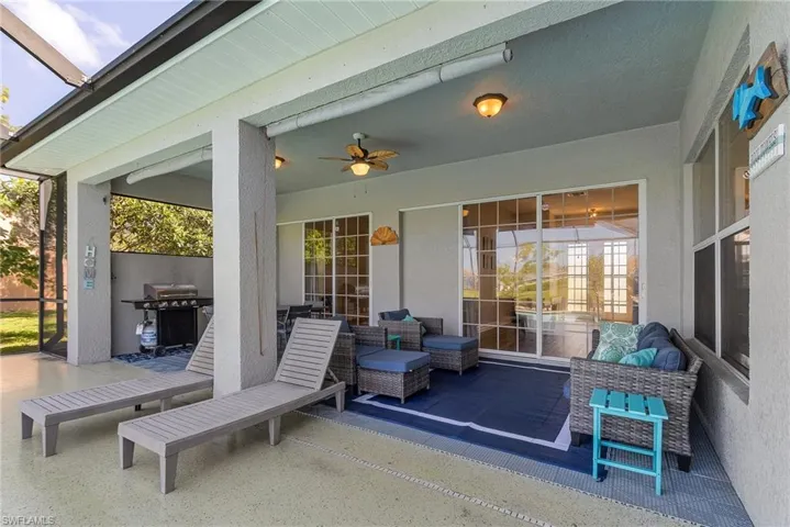 View of patio featuring ceiling fan and a grill