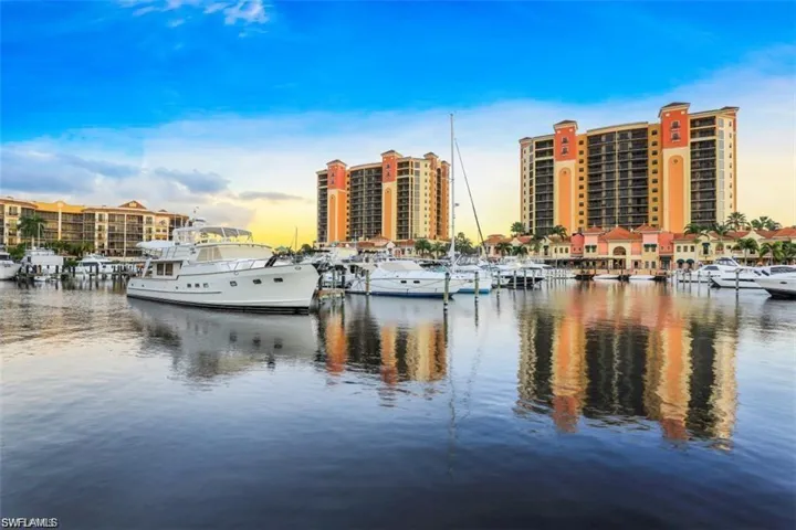 Water view with a marina and a dock
