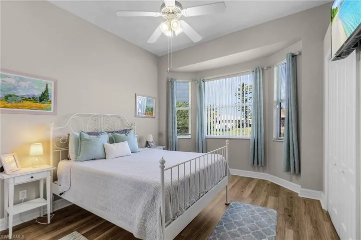 Bedroom featuring wood finished floors and ceiling fan