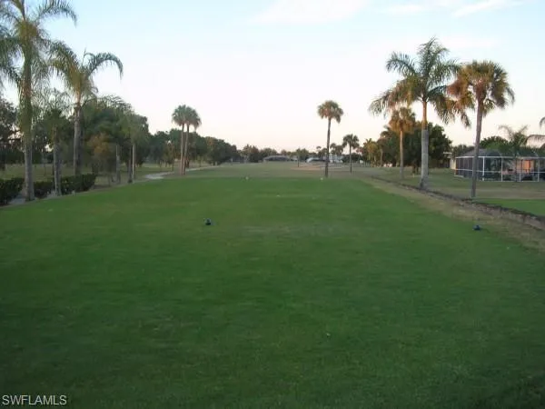 View of property's community featuring a lawn