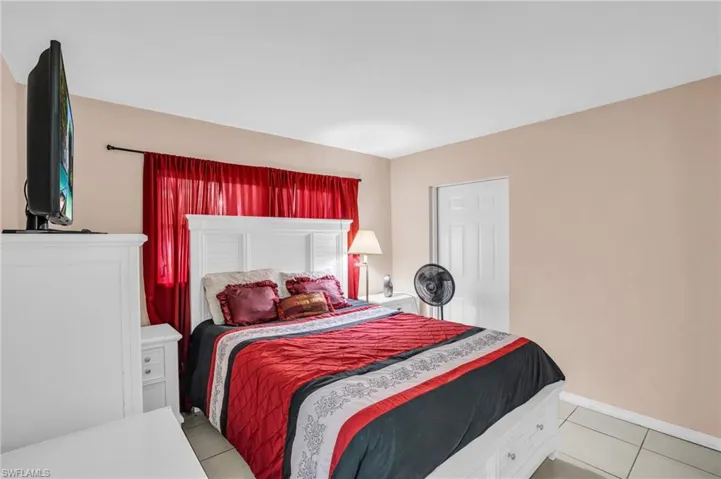 Bedroom featuring light tile patterned flooring