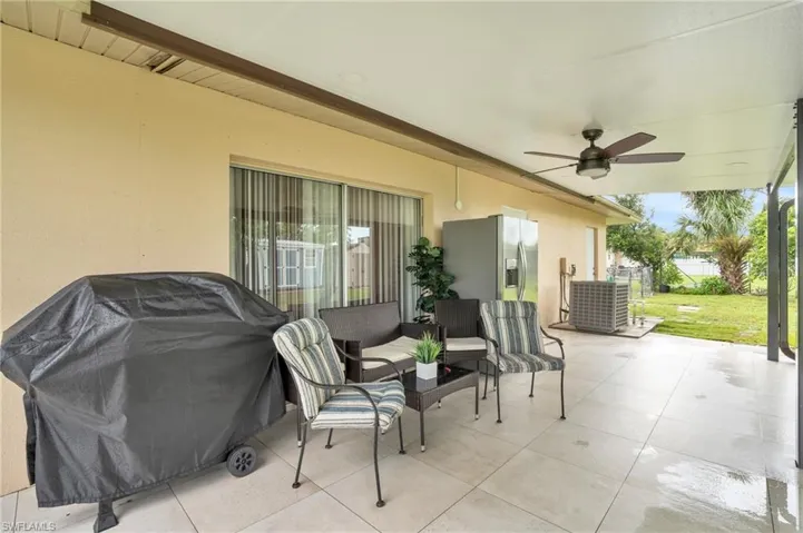 View of patio / terrace featuring grilling area, cooling unit, and ceiling fan