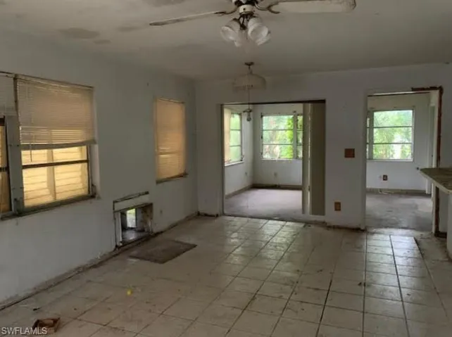 Unfurnished room featuring a ceiling fan