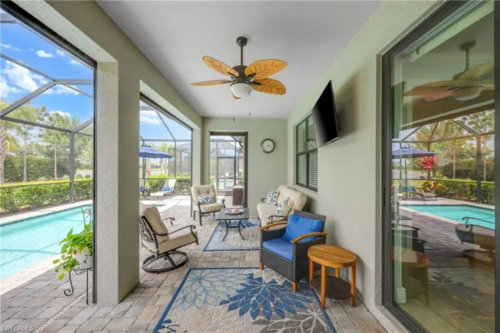 Extended covered lanai sitting area with pool views