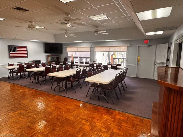 Dining room with baseboards, visible vents, and a paneled ceiling