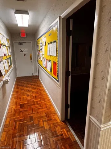 Corridor featuring baseboards