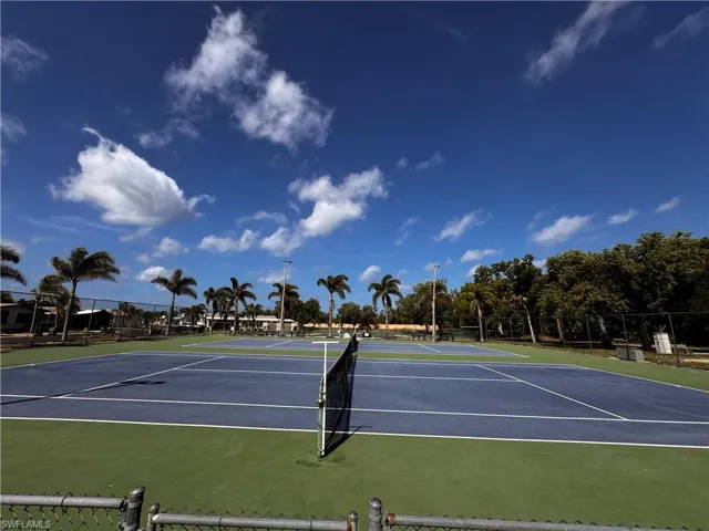 View of sport court featuring community basketball court and fence