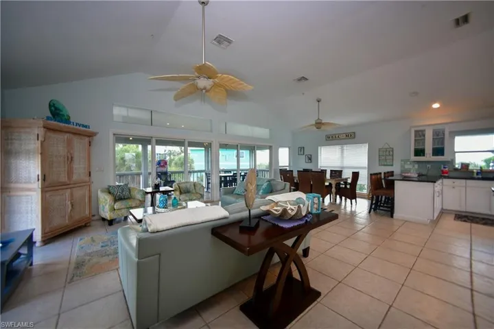 Vaulted ceiling great room with ceramic tile flooring