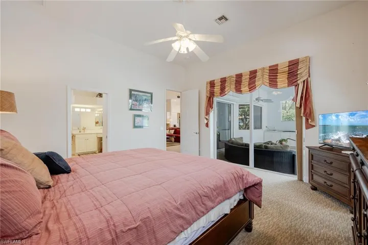 Master Bedroom with View Sliders Leading to the Lanai and Pool.