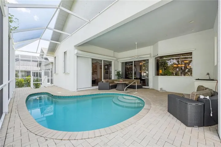 Heated Pool with Cage and Paver Deck.