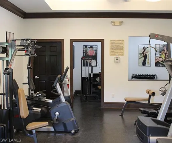Workout room featuring ornamental molding