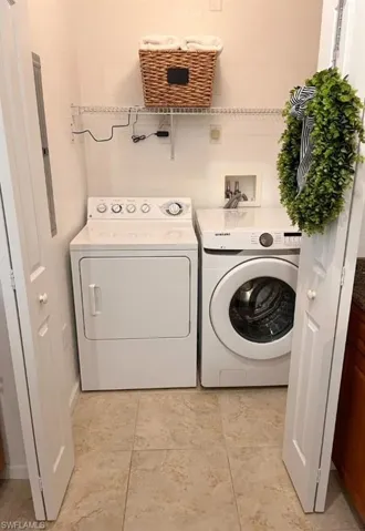 Laundry area with washing machine and dryer and electric panel