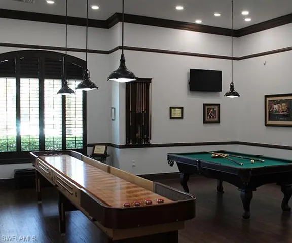 Recreation room featuring dark wood-style flooring, ornamental molding, pool table, and recessed lighting