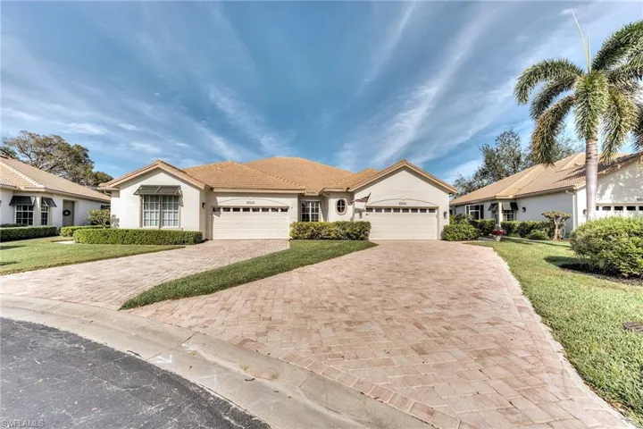 Attached villa with long paved drive