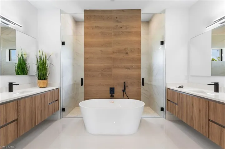 PRIMARY SUITE with SPA-STYLE BATHfeaturing a FREESTANDING SOAKING TUB