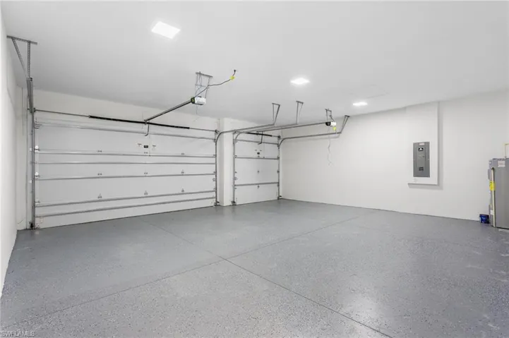 A 3-CAR GARAGE offers ABUNDANT ROOM forvehicles, storage, or weekend toys