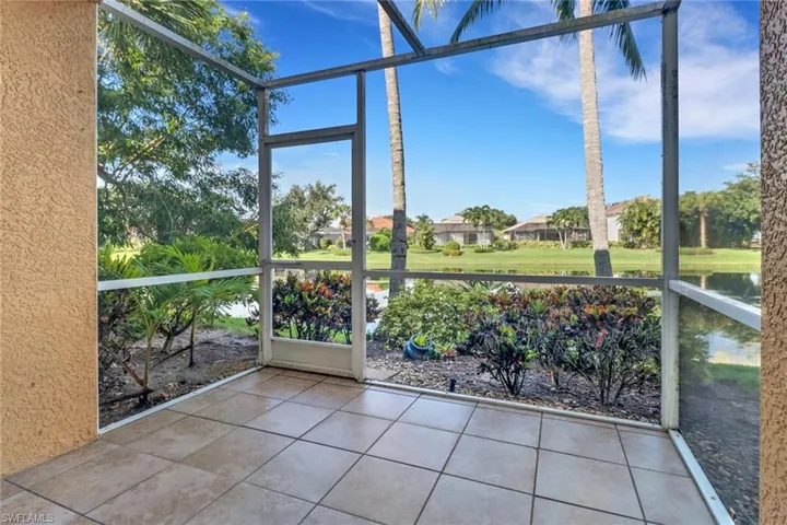 Unfurnished sunroom featuring a water view