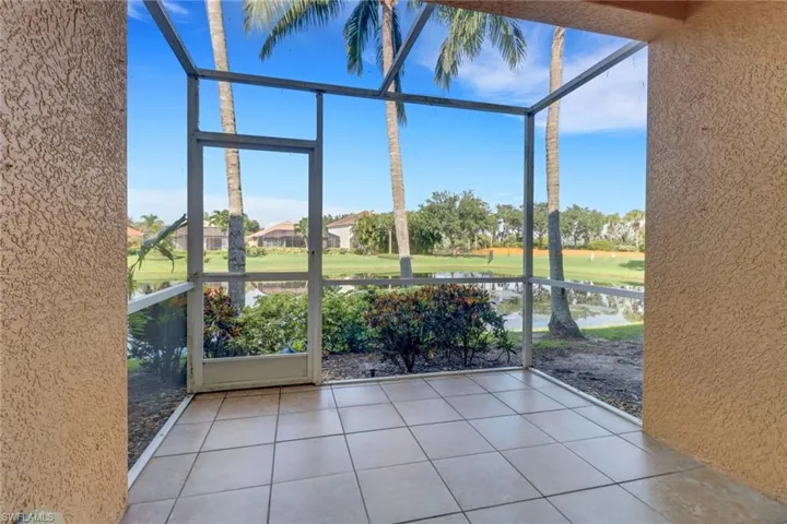 Unfurnished sunroom featuring a water view
