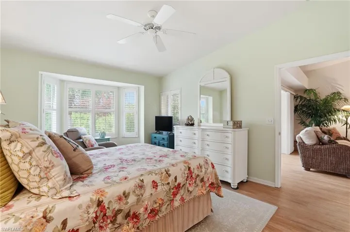 Bedroom with light wood-style flooring and a ceiling fan