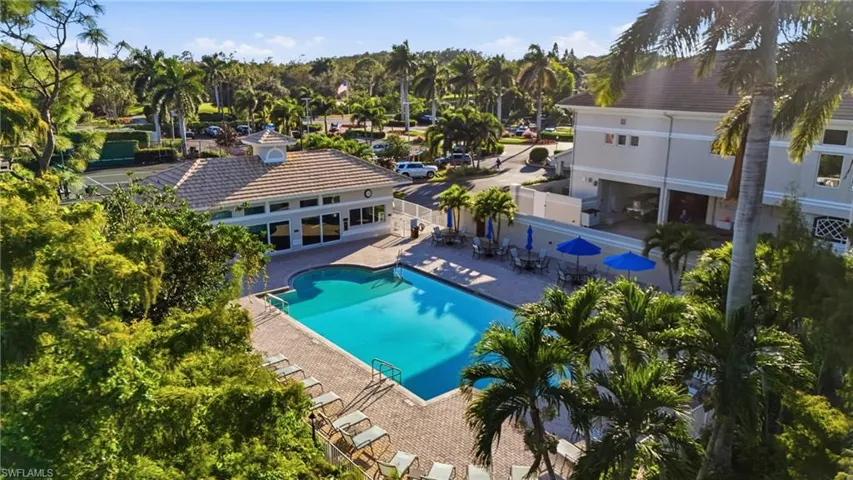 Community pool with a patio