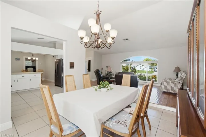 Dining area featuring tiled flooring and a decorative chandelier