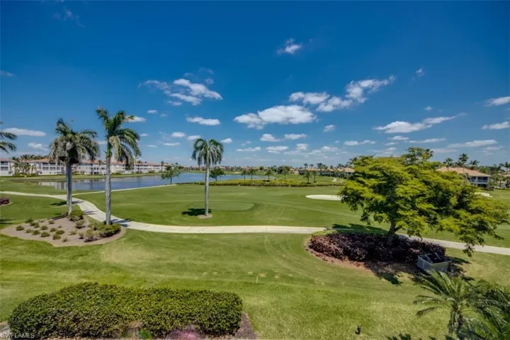 View of property's community with a water view, golf course view, and a yard