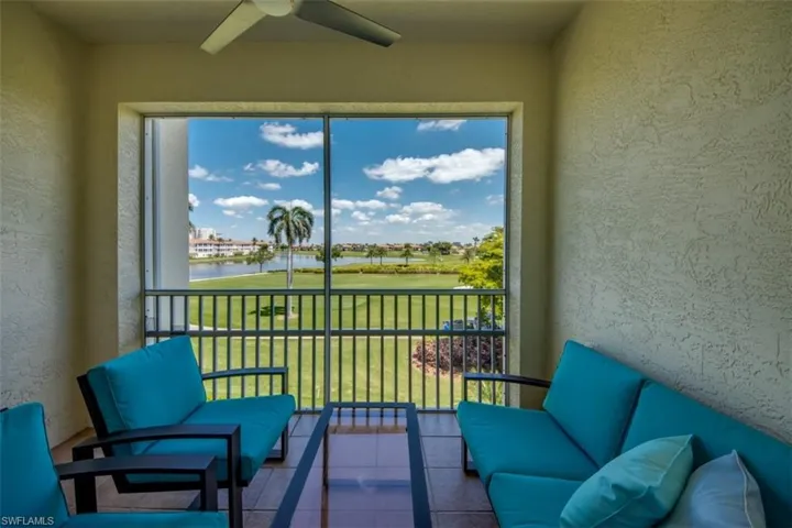 Sunroom / solarium featuring a water view