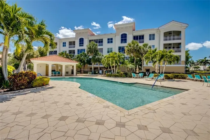Community pool featuring a patio area