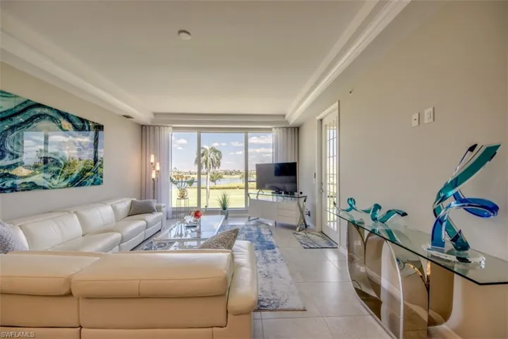 Living room with light tile patterned flooring