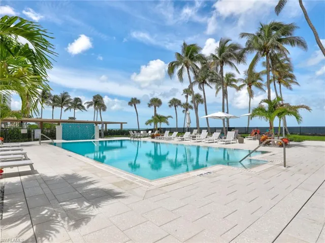 Community pool featuring a patio