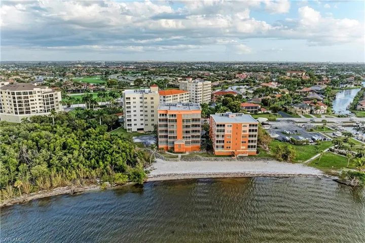 Aerial view of a nearby body of water and apartment complex