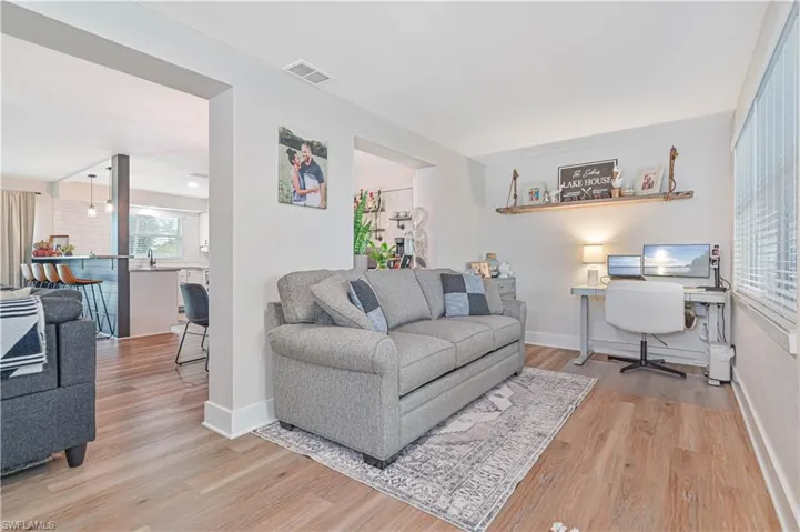 Living room featuring light hardwood / wood-style flooring and sink