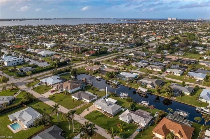 Birds eye view of property featuring a canal view