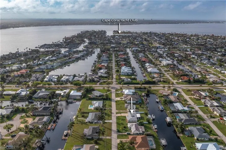 Bird's eye view featuring a view of the home, it's neighborhood, and the Caloosahatchee River