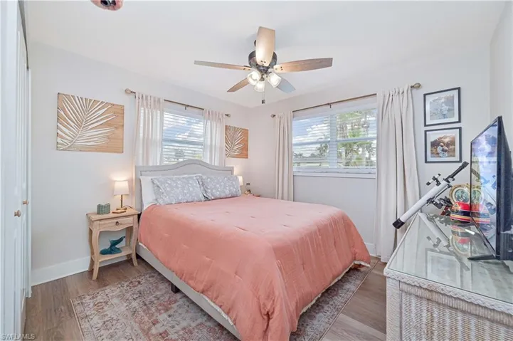 Bedroom featuring light wood-type flooring and ceiling fan